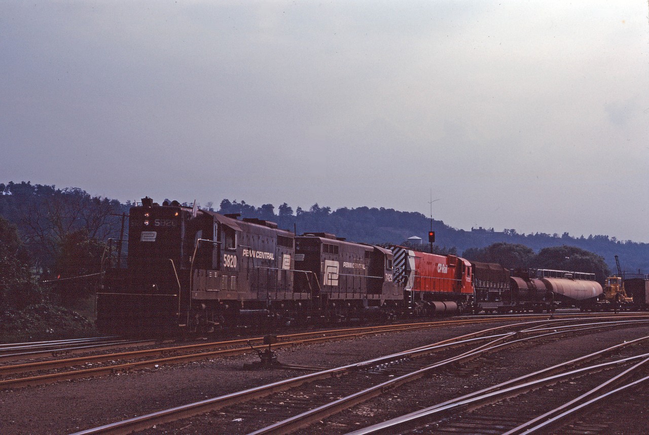 Likely charging the air after doubling the outbound train together, the Starlight prepares to depart for Toronto Yard behind Penn Central GP7 5820, GP9 7429, and fairly new CP M636 4722. It looks like they weren't able to wye the power and had to change ends, since the CP unit likely led the train to Hamilton (which was normally the case when a CP unit was added to assist PC power).
