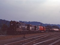 Likely charging the air after doubling the outbound train together, the Starlight prepares to depart for Toronto Yard behind Penn Central GP7 5820, GP9 7429, and fairly new CP M636 4722. It looks like they weren't able to wye the power and had to change ends, since the CP unit likely led the train to Hamilton (which was normally the case when a CP unit was added to assist PC power).