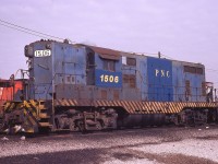Precision National GP7 1506 rests at Canadian Pacific's Agincourt Yard in Toronto, Ontario on March 2, 1975.  The unit was built by EMD for the Florida East Coast Railway in 1952 and still wears FEC's blue paint.