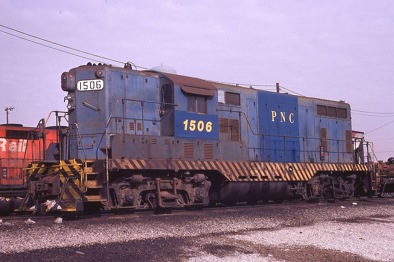 Precision National GP7 1506 rests at Canadian Pacific's Agincourt Yard in Toronto, Ontario on March 2, 1975.  The unit was built by EMD for the Florida East Coast Railway in 1952 and still wears FEC's blue paint.