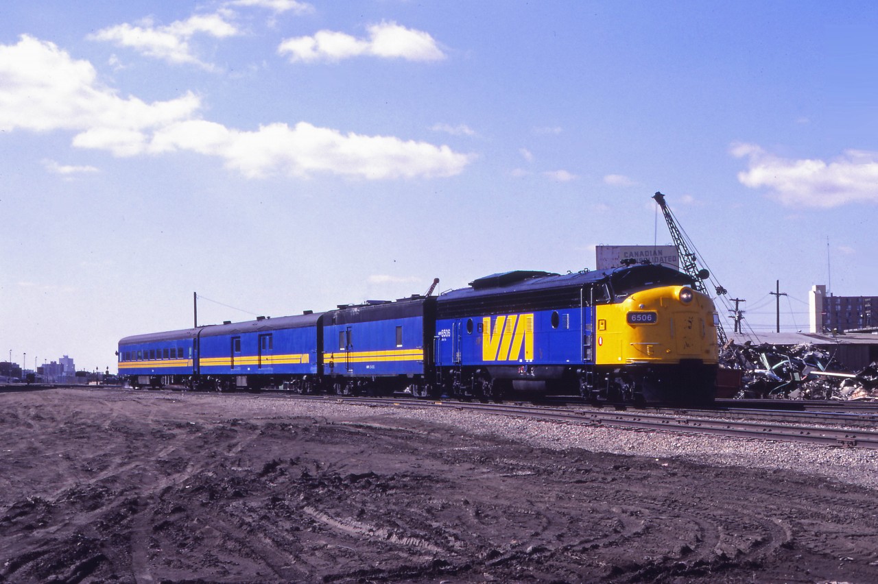 From 15 November 1981 until 2 June 1984, VIA operated daily trains 103 (westbound) and 104 (eastbound) between Saskatoon and Edmonton over CN lines. A pair of sister trains (Numbers 109 and 110) ran between Saskatoon and Regina over CN, then over CP lines from Regina to Portage la Prairie, using the CN Rivers sub between a CP-CN connection west of the Portage station and Winnipeg Union Station. These trains were not overly successful and from June 1984 to May 1985, VIA restored through service over an all-CN route (“the Panorama”). Subsequently, on 1 June 1985, VIA restored the Super Continental between Vancouver, Edmonton, Saskatoon, and Winnipeg. Here we see No. 104 departing Edmonton on a spring 1984 day, just into its 6 hour and 50 minute trip to Saskatoon.