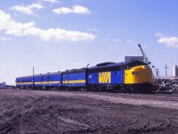 From 15 November 1981 until 2 June 1984, VIA operated daily trains 103 (westbound) and 104 (eastbound) between Saskatoon and Edmonton over CN lines. A pair of sister trains (Numbers 109 and 110) ran between Saskatoon and Regina over CN, then over CP lines from Regina to Portage la Prairie, using the CN Rivers sub between a CP-CN connection west of the Portage station and Winnipeg Union Station. These trains were not overly successful and from June 1984 to May 1985, VIA restored through service over an all-CN route (“the Panorama”). Subsequently, on 1 June 1985, VIA restored the Super Continental between Vancouver, Edmonton, Saskatoon, and Winnipeg. Here we see No. 104 departing Edmonton on a spring 1984 day, just into its 6 hour and 50 minute trip to Saskatoon.