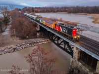 Grand Trunk Western GP9R GTW 4616 solo working on CN X54631 31, taking 15 pieces of ex- York Durham Heritage Railway now RERA's equipments from Lincolnville layover yard to Oshawa yard. Passing Mile 317 Kingston sub just about sunrise after ran around at Scarborough Jct.