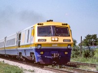 VIA 6901 is eastbound in St. Clair Beach, Ontario on August 12, 1982.