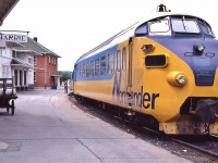 <br>
<br>
VIA Rail System Timetable reference mark #70: “ stops to entrain passengers only”,
<br>
<br>
and onward to the Orillia station stop, subject to footnote #70,
<br>
<br>
Daily, except Saturday, ONR #121,  Northlander 1984  departs Barrie, June 22 1980 Kodachrome by S.Danko
<br>
<br>
Observe:
<br>
<br>
The Toronto Sun newspaper box
<br>
<br>
The loaded baggage cart awaiting the 14:55 arrival of VIA Rail #3 Super Continental.
<br>
<br>
and an unknown photographer.
<br>
<br>
sdfourty
