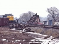 <br>
<br>
   More action at CN Beachville, February 18, 1984 Kodachrome by S.Danko
<br>
<br>
VIA 6762 west creeps onto wreck site at a stately 10 m.p.h. Note the downed communication / hydro cables.
<br>
<br>
February 14, 1984: A 25 car CN train derailed four miles west of Woodstock ( Beachville) causing $1 million damage. Half mile track torn up, propane tankers included in consist. Heavy rains blamed for weakening the track bed. Reportedly every spring new remnants of the derailment can be seen along the Beachville Thames River Trail – pushed up by the winter frost.
<br>
<br>
More
<br>
<br>
<a href="http://www.railpictures.ca/?attachment_id=  50490">  VIA 6765 east   </a>
<br>
<br>
sdfourty

