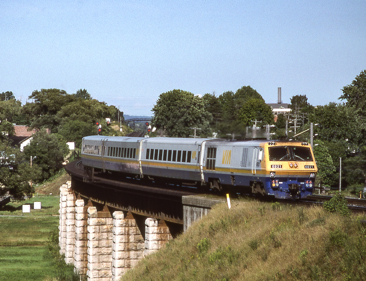 VIA 6921 is crossing the bridge in Port Hope, Ontario on August 6, 1987.