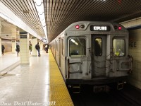 One of the fringe benefits of commuting downtown from Vaughan that made it somewhat tolerable was being able to shoot subways all the way down, or just staying onboard until our stop at Dundas (Ryerson) or Union. The old 1970's Hawker Siddeley H4's (with their orange and grey bench seats, and large roof ventilator fans) were becoming somewhat of an endangered species as the new TR subway cars began to show up, so photos of those were always in order while the getting was still good. Dirty TTC H4 5650 trails an eastbound consist at Yonge Subway Station on the crosstown Bloor-Danforth subway line ("Line 2" today) for Kennedy, as a westbound H4 consist with 5660 leading accelerates out of the station on the opposite track for Kipling. The bathroom tile decor is original to when the station opened in 1966.<br><br>The final H4's <a href=https://www.youtube.com/watch?v=7bvY7h06TFE>retired in January 2012</a>.  Most ended up processed into scrap metal at Future Enterprises in Hamilton.