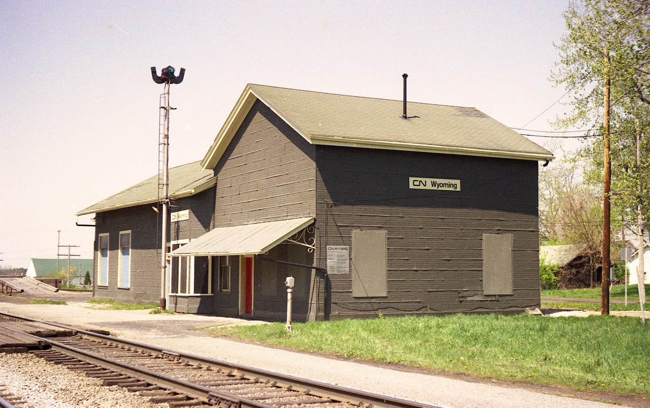 Pictured is a view looking west at the old x-GTR, now CN station in Wyoming.  The structure was built in 1874 and presented a much more ornate appearance than in this, its' rather sad looking final days. Wyoming station was removed in the early 1980s. A small VIA kiosk is all that currently represents the town.