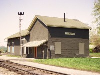 Pictured is a view looking west at the old x-GTR, now CN station in Wyoming.  The structure was built in 1874 and presented a much more ornate appearance than in this, its' rather sad looking final days. Wyoming station was removed in the early 1980s. A small VIA kiosk is all that currently represents the town. 