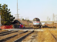 The year 1995 started off on a rather sad note for all rail commuters on VIA and Amtrak who began their day using Grimsby's fancy old station. For on the eve of the last day of 1994, an electrical fire destroyed this well loved landmark.
Here, we see the morning train stopping for passengers who no doubt feel distressed over seeing the remains of one of the most photographed railroad structures in the province.
The board & batten classic didn't stand a chance.  And it was never replaced.