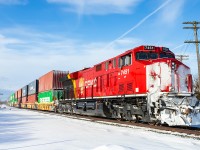 CP 7451 brings up the rear of CPKC 113 on a snowy trip down the Belleville Subdivision.