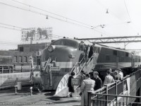 Posed for display in Montreal from September 30 – October 4, 1949, the <a href=https://www.themetrains.com/gm-train-of-tomorrow-main.htm>General Motors “Train of Tomorrow.” </a>  Consisting of E7A, GM 765, and 4 dome cars built by Pullman-Standard, the train toured the USA and Canada from 1947 – 1949, showcasing a new concept of rail travel with the new domes.  Post tour, the equipment was later sold to the Union Pacific.  CNR 7913, and EMD NW2 built in 1941, can be seen at left.<br><br>During the tour, lasting from May 1947 – October 1949, the train is noted as being in Canada on three occasions.  On display at the CNE in Toronto from September 2-6, 1947, with a stop in St. Catharine’s on September 7, passing through on the CASO, from Windsor – Fort Erie on January 17, 1948, and a longer tour through Ontario and Quebec from September 22 – October 28, 1949.  Stops included London, Ottawa, Montreal, Quebec City, Sherbrooke, Oshawa, Toronto, Hamilton, St. Catharines, Stratford, Chatham, and Windsor.<br><br><i>James H. Bickerton Photo, Jacob Patterson Collection.