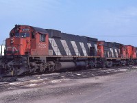 When MLW units still played a significant role in the movement of freight on CN, a trio of them are shown on the inbound receiving track at MacMillan Yard on August 7th, 1983.  The 2339 was the last of 3600 hp M636 units built for CN.  It equals the horsepower of the trailing two RS-18 units, 3734 and 3118.  I sure miss the variety we enjoyed back then.  