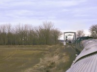 <b> I'm about to get scanned </b> <br>
VIA 693 has a clear signal and is about to leave the double track section on CN's Rivers Sub. at Mile 50.3S and pass through one of CN's numerous 'Portals' where it will be scanned with hi-def cameras and other sophisticated equipment to ensure there are no defects or concerns in the consist. <br>
The hi-intensity lighting inside the portal becomes quite evident when viewed from the dome of the Skyline car. <br>
<b> https://www.cn.ca/en/stories/20190814-machine-vision/ </b>