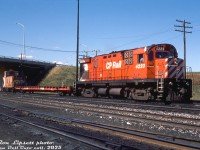 By the mid-80's, the Lindsay Turn wasn't looking so hot - a reflection of the decreasing traffic on many of the southern Ontario branchlines that were struggling to stay alive or being abandoned at the time. CP Rail C424 4223 sits at the northeast corner of CP's Toronto (Agincourt) Yard by the Finch Avenue East overpass, ready to head out onto the Havelock Sub with its short train in tow: a single empty flatcar, and a 434000-series offset-cupola steel caboose. Once on the Havelock, it would hop on the Bobcaygeon Sub at Dranoel for its ultimate destination of <a href=https://www.railpictures.ca/?attachment_id=47047><b>Lindsay, Ontario</b></a>. Rail service to and in Lindsay, once a bustling hub of branchlines itself, would end in two more years when the Bobcaygeon Sub was abandoned in November 1987, and that would be it for CP's Lindsay Turn. The 4200-series C424 fleet, modified in the early 80's from DRF to DRS-24 roadswitcher units for branchline service, would continue to operate into the late 90's before the final units were retired.
<br><br>
<i>Ron Lipsett photo, Dan Dell'Unto collection slide.</i>