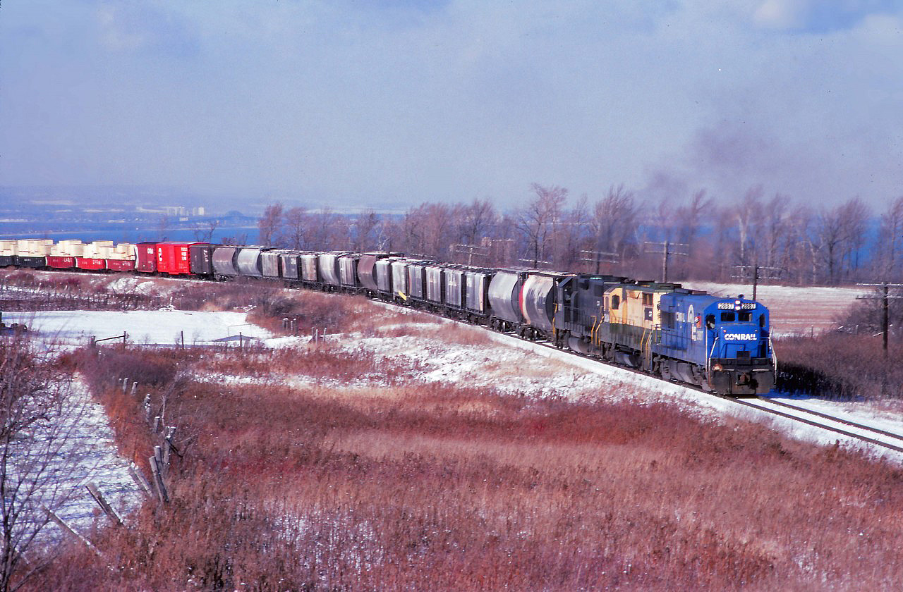 Running late this December morning, TF2 approaches the Vinemount siding as it crests the Niagara Escarpment behind CR 2887, 3642, and 8071. (Units are former Penn Central U30B, Reading GP35, and Penn Central GP38-2.)