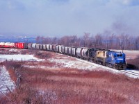 Running late this December morning, TF2 approaches the Vinemount siding as it crests the Niagara Escarpment behind CR 2887, 3642, and 8071. (Units are former Penn Central U30B, Reading GP35, and Penn Central GP38-2.)