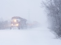 During the latter part of January 2026, Toronto received a record dumping of snow not seen since the 1940's...I went out into whiteout conditions to try and find some trains. I started locally on the North Toronto Sub and as luck would have it, what I believe to have been CP no.113 appeared out of the snow trudging through the storm westbound with CP 8735 up front. After the North Toronto I headed east to <a href="https://www.railpictures.ca/?attachment_id=58346"> Danforth </a> in order to shoot GO and VIA in the snow.
