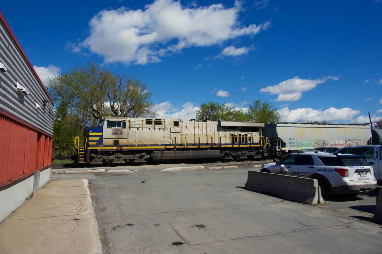 CN 305 is passing Coteau Station with an ex-CREX unit as the sole head end unit.