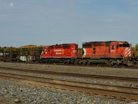 CP 6045 and 6043 sunning in the yard at Cartier as the Conductor slaps a brake on, finishing a long day of dropping rail West of town on the Nemegos sub. 