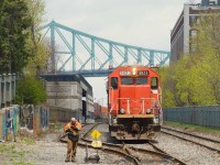 GTW 5823 is leading CN 500 as the conductor prepares to throw a switch in the Port of Montreal.
