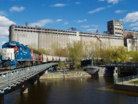 CN 596 is entering the Port of Montreal with a long string of grain cars.
