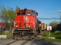 CN YRP003 is shoving two boxcars towards a client (getpaq) in east end Montreal.