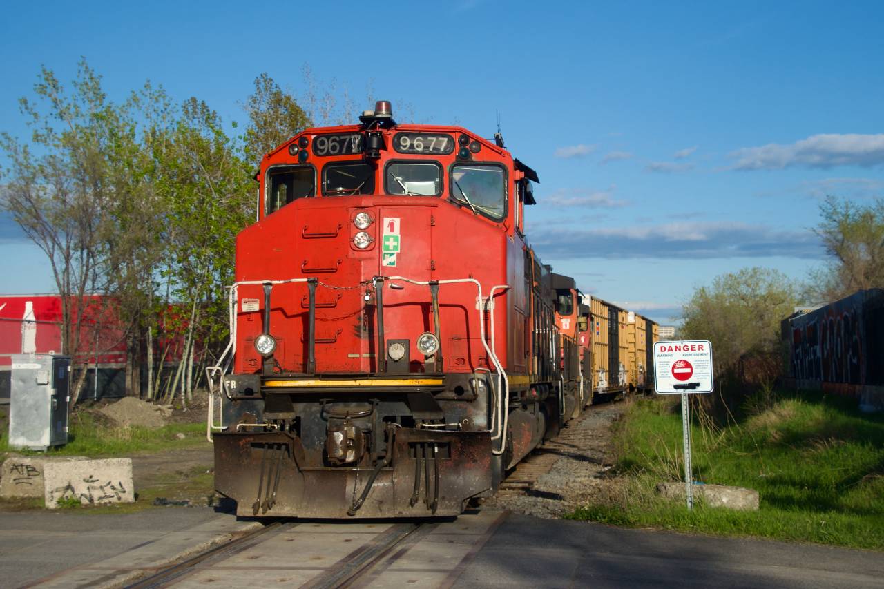 CN YRP003 is shoving two boxcars towards a client (getpaq) in east end Montreal.