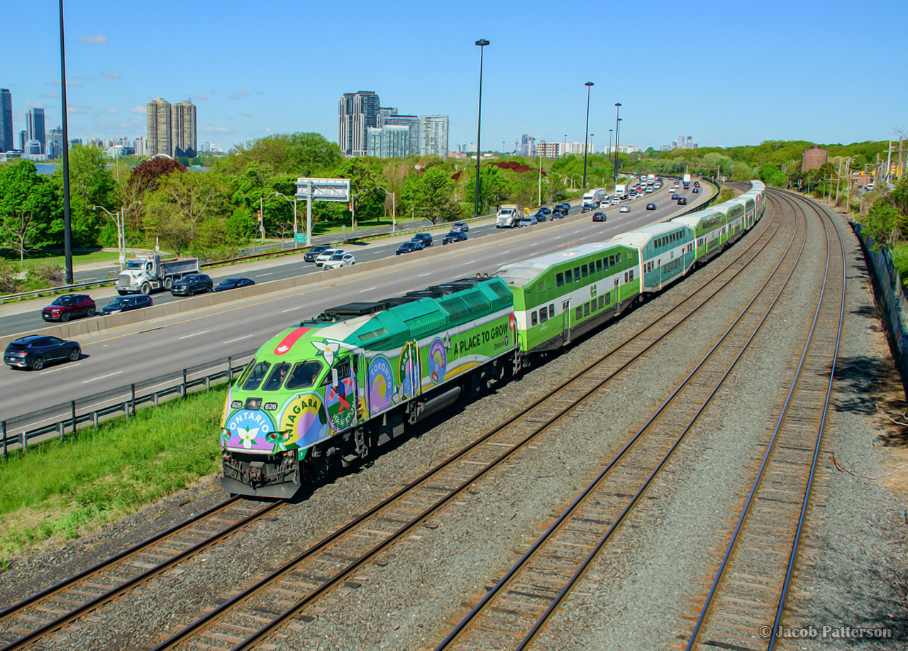 GO 626, donning the new “A PLACE TO GROW” wrap, swings through the curve at Sunnyside on the point of train 1610 from West Harbour.  The eye catching design features various place names served by the GO network.