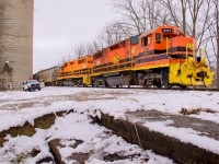Easing back into the siding at Mitchell, 581 makes a lift and setoff under the watchful eye of a track foreman.  A brief chat, an exchange of coffees, and 581 will be off to Goderich in a few minutes.  

<br><br>Nestled beneath the nearby trees, a concrete staircase sits abandoned.  Once used by CNR passengers to <a href=https://ontariorailwaystations.wordpress.com/wp-content/uploads/2021/10/mitchell-cnr-3.jpg>access the station platform,</a> a revenue passenger has not been seen since the last RDC run in October 1970, with the station gone soon after.
