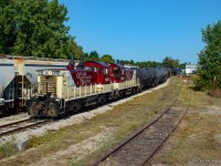 Built in the late 50's for branchline road switching, and still working these assignments, a pair of GMD SW1200RSu's are seen switching out Future Transfer in Tillsonburg.