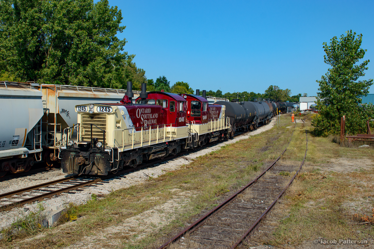 Built in the late 50's for branchline road switching, and still working these assignments, a pair of GMD SW1200RSu's are seen switching out Future Transfer in Tillsonburg.