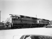 Not your typical Bill Grandin "drive-by" yard shot: the power for Erie Lackawanna train NE97 sits inside CP's Toronto (Agincourt) Yard, one of many trains detouring through Canada over CN and CP due to Hurricane Agnes damaging EL's rail network in the US. Pictured are EL SD45 3624, C424 2413, U25B 2505 and 2501 (not shown), laying over before continuing their trip west over CP and back into the states.
<br><br>
No Canadian railways ever opted for EMD's big 3600hp V20-powered SD45 model, most preferring the 3000hp SD40/SD40-2 as their normal high horsepower 6-axle unit of choice. EL rostered a sizable fleet of SD45 and SDP45 units, that later joined PRR's fleet in the 1976 Conrail merger.
<br><br>
<i>Bill Grandin photo, Dan Dell'Unto collection negative.</i>