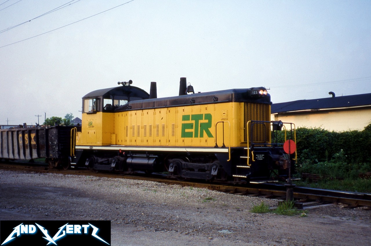 During a hazy summer day, Essex Terminal Railway (ETR) SW1200 105 is seen switching cars in Windsor, Ontario. The unit was built in 1956 and still continues to work today on ETR. In 2021, Sarnia-based Lambton Diesel Specialists (LDS) had completed an extensive rebuild of the unit as well as a full repainting into a heritage green and yellow scheme similar to the one it wore when delivered new.