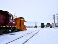 <b> Meeting at the Port </b> <br>
It's a cool and overcast April 30, 2026 morning in Churchill, MB. <br>
VIA 693 had backed into the station track at 10:00 and an hour and a half later the HBRY way freight with HBRY 55376 (ex-CN 55376) single track snowplow pulled up alongside. <br>
The VIA consist will sit idling until 19:30 this same evening while its crew gets their mandatory rest before making the return trip to Winnipeg. <br>
The HBRY way freight will get a fresh crew right away and start switching todays consist onto various ramp tracks in the yard across from the station. <br>
It was quite the sight to watch the way freight make all its switch moves with the plow still attached to the locomotives. <br>
When the switch list was completed the four units and plow headed south out of town to the wye and turned the plow. On return to Churchill, they dropped the plow behind the consist of VIA 692 while they made up their return train.