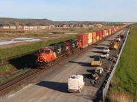 Q139 CN 3061 CN 3170 at Britannia Road. The trucks are starting to show up for another days work on the new track construction.



