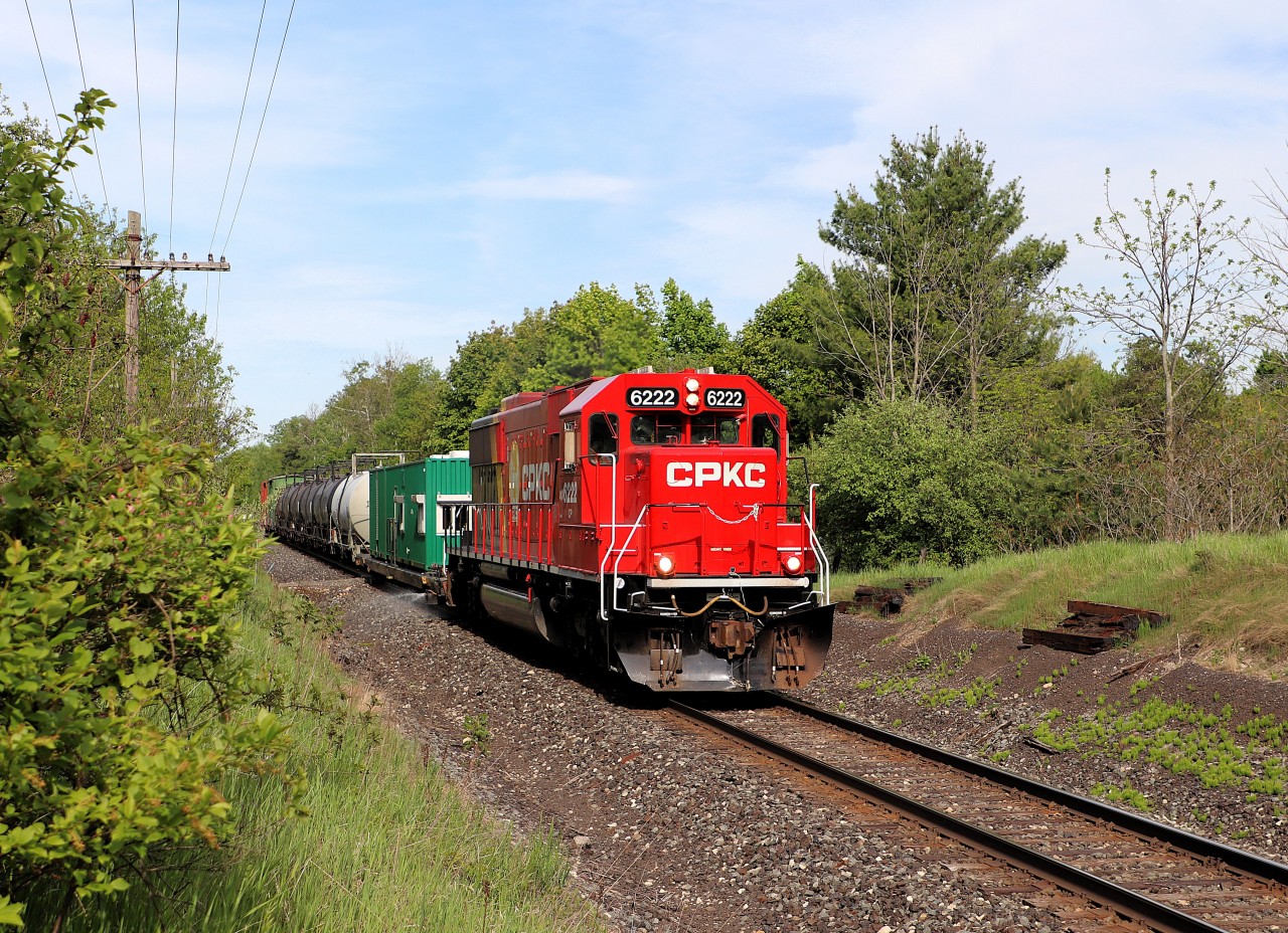 After waiting at Guelph Junction for quite some time for CPKC 134 to arrive and do its work there, CPKC finally got underway to do its yearly weed spraying program. Here, the bright clean EMD SD60 in CP 6222, sporting the new paint scheme, sprays along around mile 42.7 as it continues its journey westward.