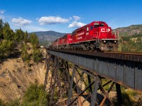 This might be the most attention that Trail BC has ever received on Railpics haha. With 2 other posts already up, I figured I'd add my own photo of modern day. The Kootenay Valley Railway "hotshot" is on the last leg of its 330 mile journey from Golden BC to Trail BC as it glides over the Stoney Creek trestle in the neighbourhood of Tadanac at a calm 10mph. The KVR is an internal shortline that CP has which picks up the wayfreight at McConnell yard in Kitchener BC and takes it round trip to Trail. Once in Trail, they change ends, become CP A18, and set off eastbound to Golden. The entire trip takes 3 days, and runs daily so there are always 3 sets of EMDs running around in the Kootenay Valley region of Southern BC. A18 this day was led by SD40-2 CP 6042, with CP 5003, and CP 2302 trailing. By the way, the hotshot nickname was given to the train ironically as they never reach speeds above 15mph on the KVR. 