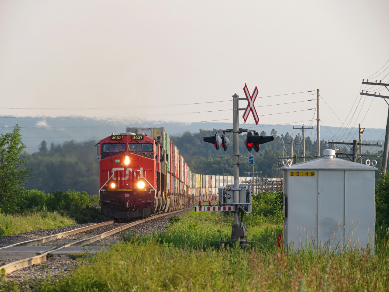 What i believe to be intermodal train number 120 is entering the town of Saint-Pascal, on its way to the port of Halifax. The power that evening was nothing out of the ordinary, maybe aside for a former Citirail ES44AC trailing in 3rd position. CN had just purchased these locomotives at the time, i believe it was my first time seeing them under their new ownership.