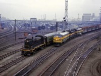 Coming off the high line, CN 452 from North Bay to Mimico passes by Spadina coach yard, where S13 8517 is seen making switching moves.

<br><br><i>Scan and editing by Jacob Patterson.</i>