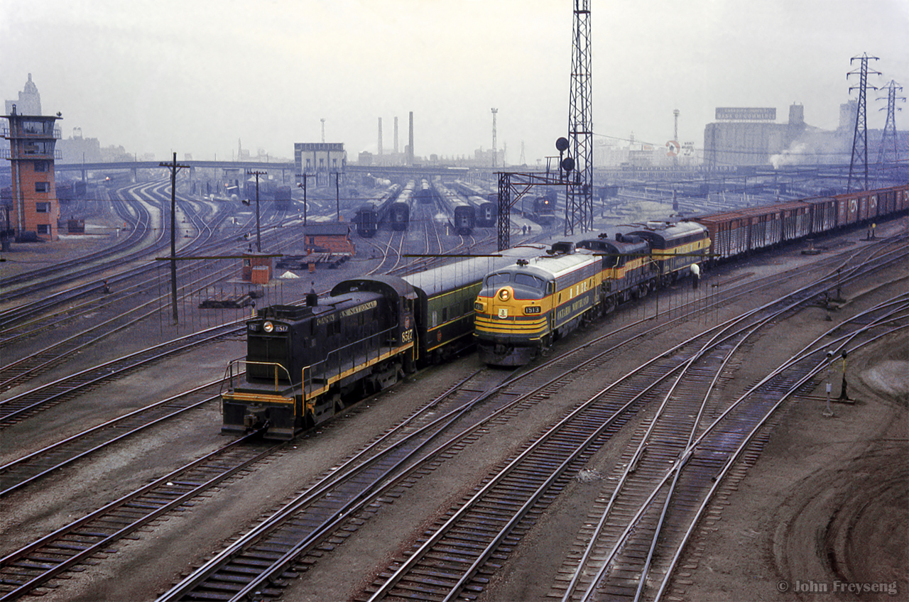Coming off the high line, CN 452 from North Bay to Mimico passes by Spadina coach yard, where S13 8517 is seen making switching moves.

Scan and editing by Jacob Patterson.