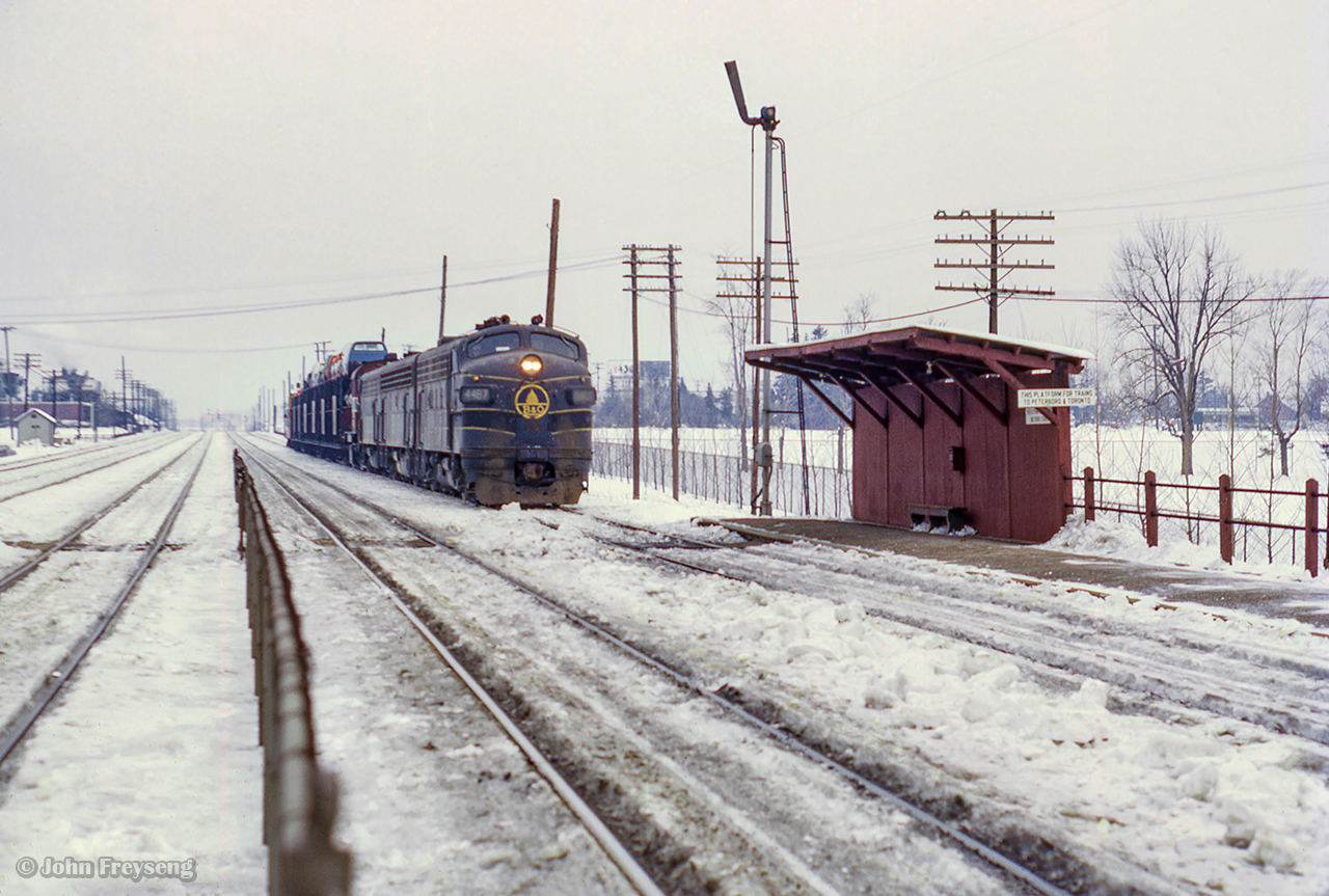 Rolling eastbound into Agincourt Yard, Extra B&O 4487 (class lights lit) approaches the north platform at Agincourt station with a short cut of autoracks.  Taken in mid-late February, the lease of B&O F units began only just before this on February 10, 1972.

More information on the leae of B&O F units can be found here.

Scan and editing by Jacob Patterson.