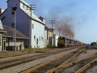 Rumbling east out of the evening sun, what is likely NI42 approaches the depot at Blenheim, where the operator is ready to hoop up the orders.  Note the single-stall engine house in the distance at right.

<br><br><i>Scan and editing by Jacob Patterson.</i>