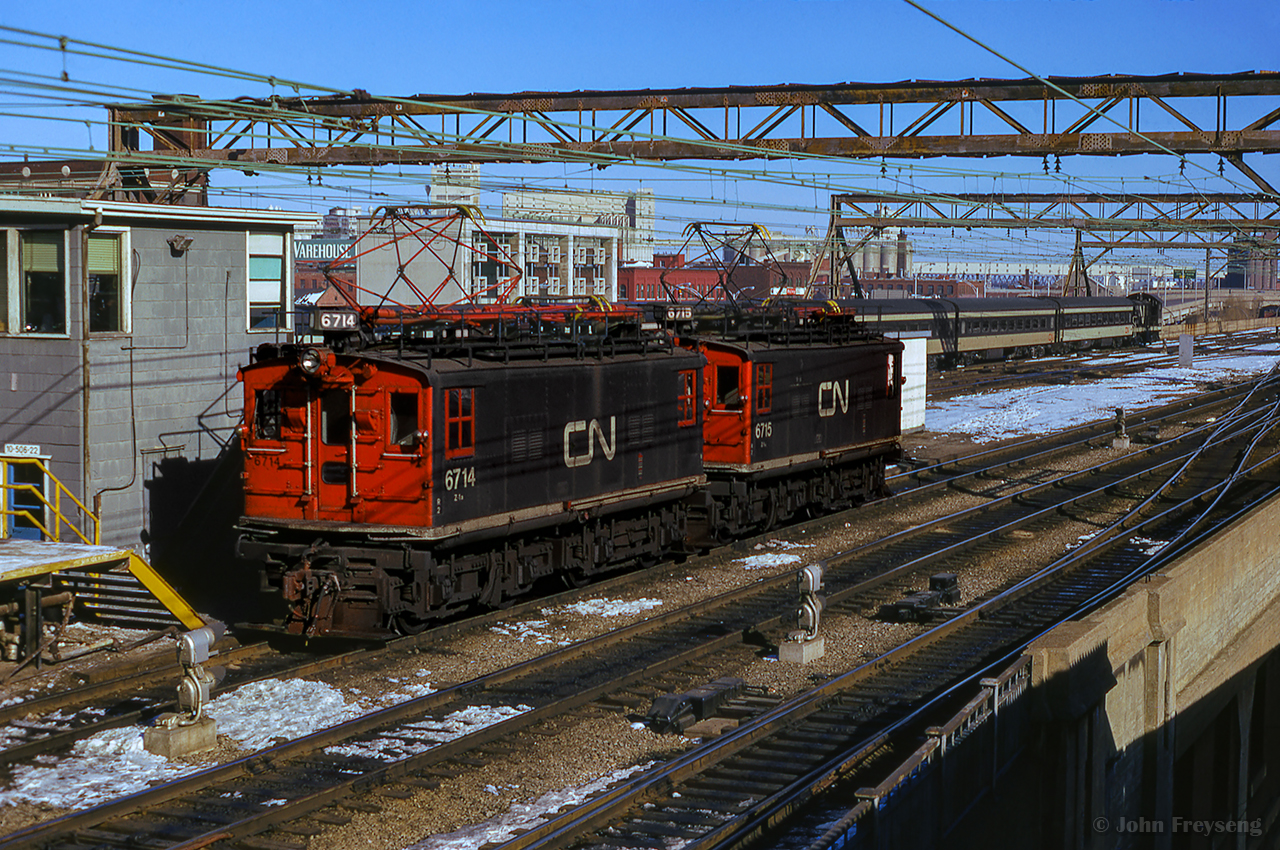 A pair of CN's boxcab electrics back towards their consist at Gare Centrale.

Scan and editing by Jacob Patterson.