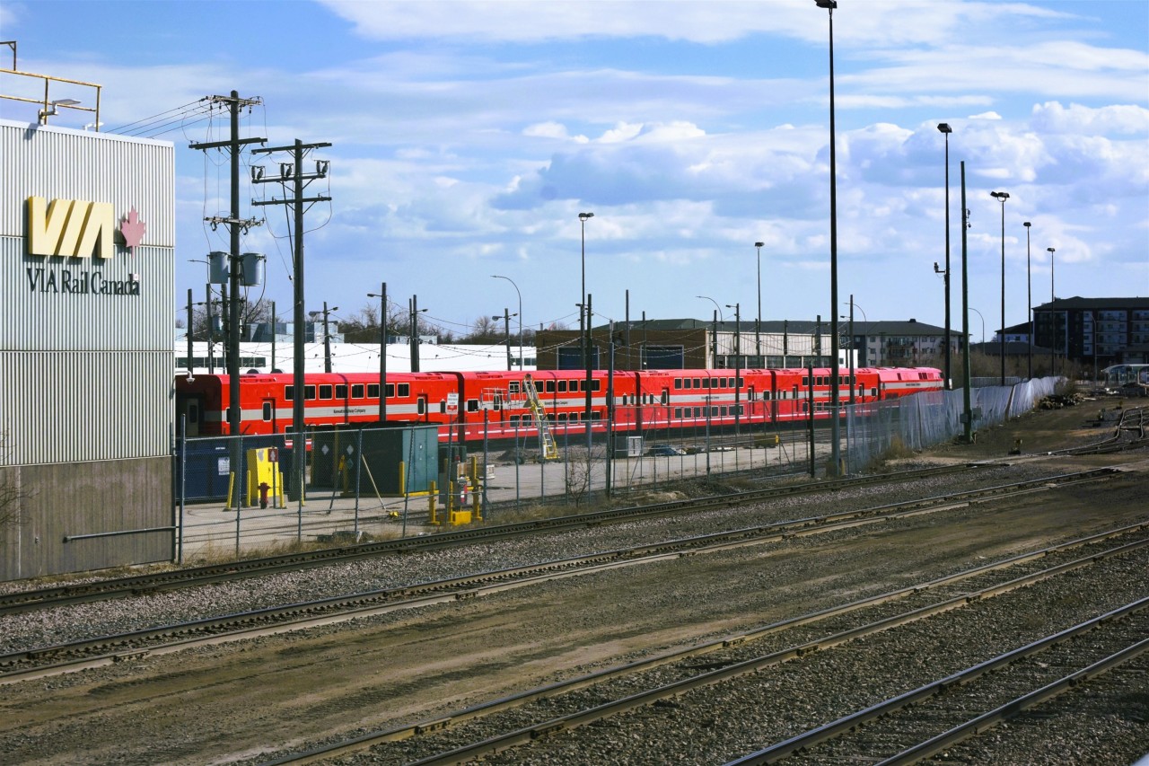 No score for this Puk  
A year after being delivered to The Keewatin Railway Company, KRC 2509 and 4 double deck coaches sit silently inside the fenced compound at the VIA Rail Maintenance Center 1.5 miles west of Union Station in Winnipeg, MB. 
With entry/exit doors 4 feet above top-of-rail, this newly refurbished equipment doesn't quite fit in on KRC's route from The Pas, MB to Pukatawagan as there are no elevated platforms on that line! 
I'm guessing the consist is in town to be modified for a more convenient ingress and egress method for passengers.