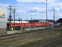 <b> No score for this Puk </b> <br>
A year after being delivered to The Keewatin Railway Company, KRC 2509 and 4 double deck coaches sit silently inside the fenced compound at the VIA Rail Maintenance Center 1.5 miles west of Union Station in Winnipeg, MB. <br>
With entry/exit doors 4 feet above top-of-rail, this newly refurbished equipment doesn't quite fit in on KRC's route from The Pas, MB to Pukatawagan as there are no elevated platforms on that line! <br>
I'm guessing the consist is in town to be modified for a more convenient ingress and egress method for passengers. <br>