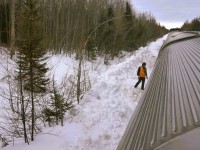 <b> No HBD, no problem! </b> <br>
There are a few new electronic Hot Box Detectors on the HBR's subdivisions between The Pas and Churchill, but where they have yet to be installed, the hand-held laser gun method is deployed every 40 or so miles along the remote route. <br>
Seen here is VIA 692's second engineer, who has climbed down from the left side of the locomotive cab at Munk, MB Mile 269.0 on HBR's Thicket Sub. to use a laser temperature sensing device to check the axle bearings on each car in the trains consist. <br>
A slow roll-by of the entire length of the train from locomotive to the tail end sleeper, a stop, a crossover to the other side, then a slow reverse movement to check bearings on the opposite side is undertaken before reboarding the locomotive and continuing the journey. <br>
This procedure is done at predetermined, safe, and snow cleared locations along the way. <br>
It sure beats the old Tempilstik method! :-)