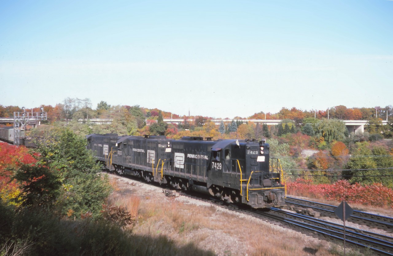 The colours have just started to change as the Starlight makes its usual late afternoon appearance at Bayview behind PC 7429, 5820, and 7430 on a fine October 1974 afternoon. The fans preferred TH&B units on this train; however, it turns out that the black PC units were more unusual--Penn Central only had a corporate existence from 1968 to 1976 whereas TH&B units were found on the Starlight and Kinnear from 1966 until 1985!