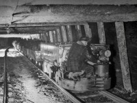An old picture I found at the Atlas Coal mine. Honestly pretty impressive the guy is wearing a hard hat, but it is very logical. These mining cars used to be pulled by horses. This battery powered steel horse (or tunnel motor) depending on how you put it is much better suited for the job. Not sure on the date. 